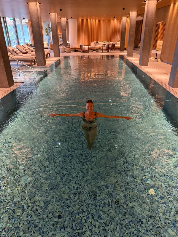 Enjoying a swim in a warm, wood-paneled indoor pool